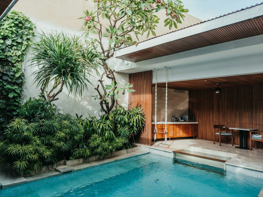 a pool with a table and chairs next to it