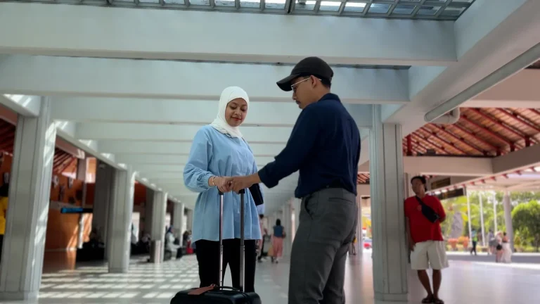 Airport assistant meeting an arriving guest in the terminal