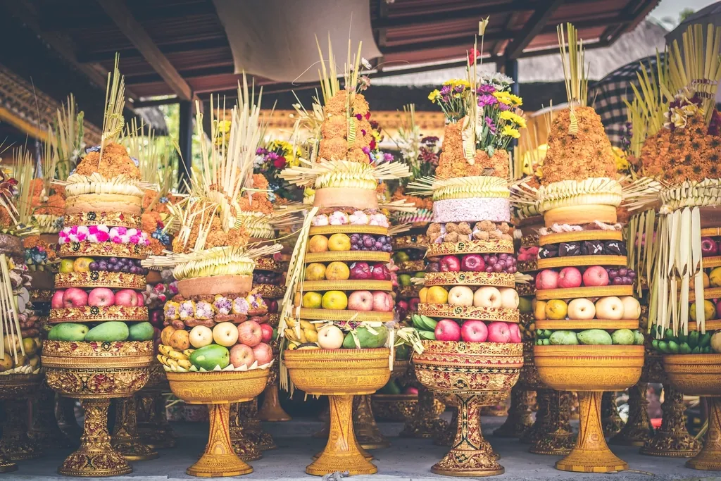 Towering Balinese fruit offerings at a temple ceremony