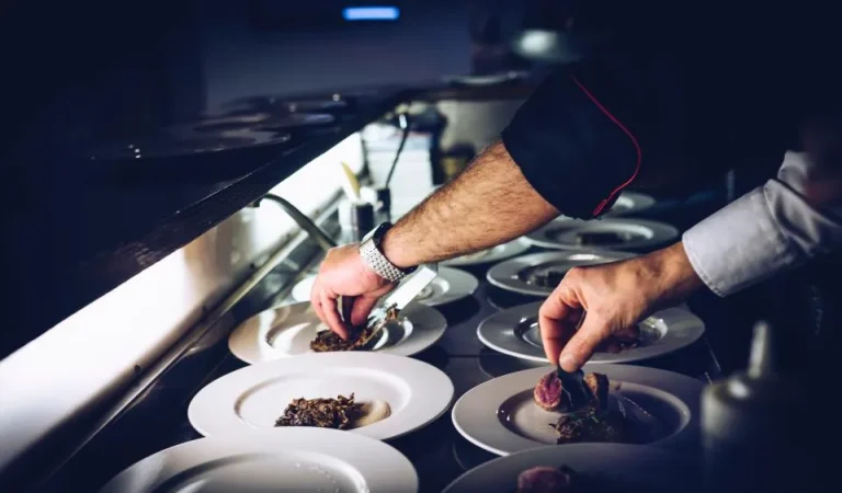 Chef plating a dish by hand