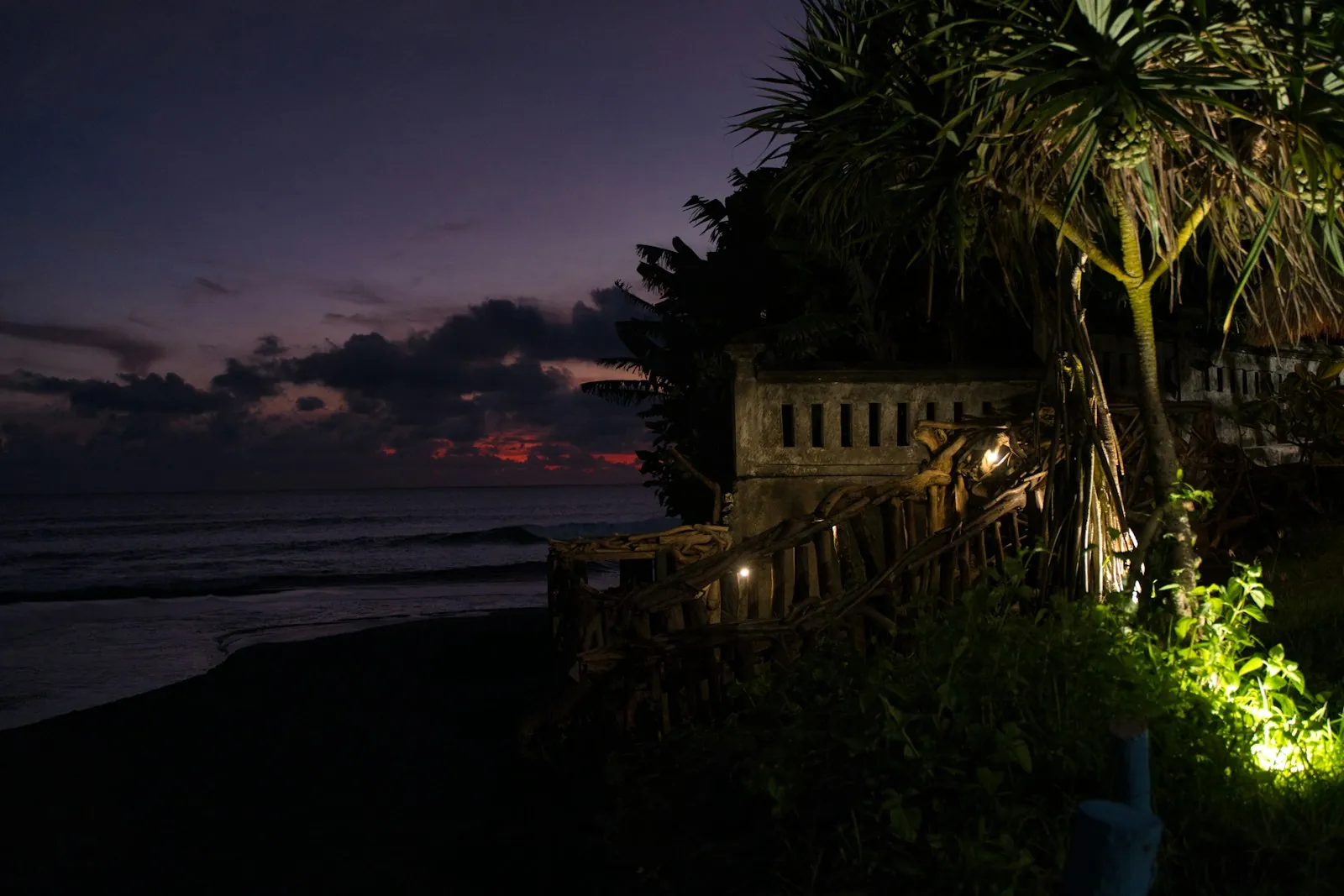 Clifftop resort lights at dusk above the sea