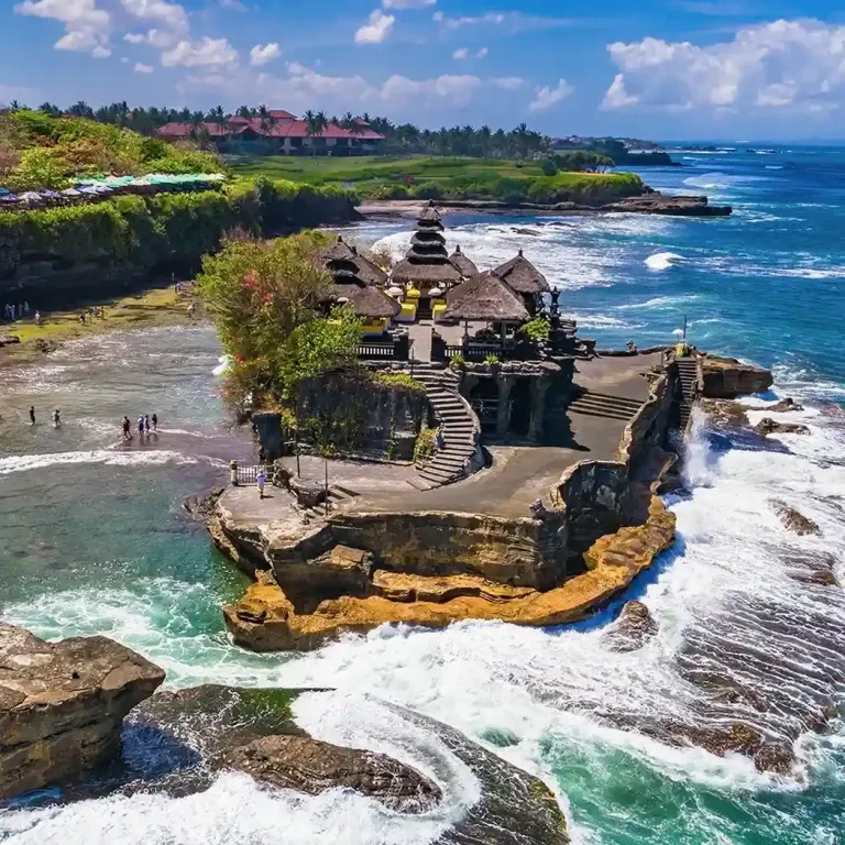 Aerial view of Tanah Lot temple from a helicopter tour