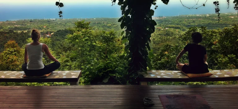 Yoga on a deck overlooking the jungle