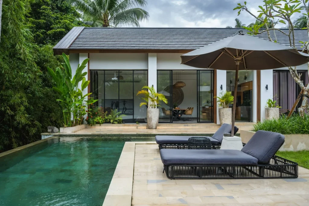 Modern private villa with pool and sun loungers