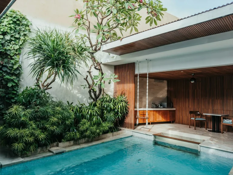 Villa pool beside an open-plan living pavilion