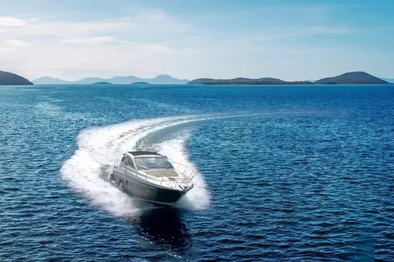 Private motor yacht cruising at speed in open water