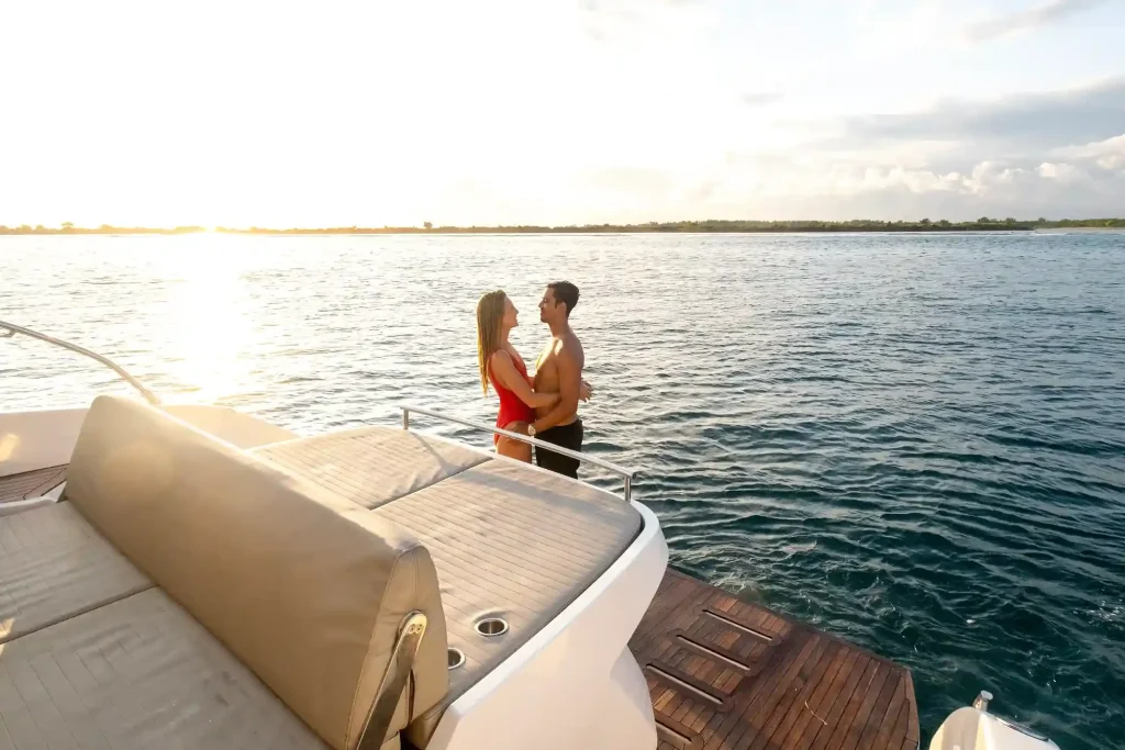 Couple on the aft deck of a private yacht at sunset